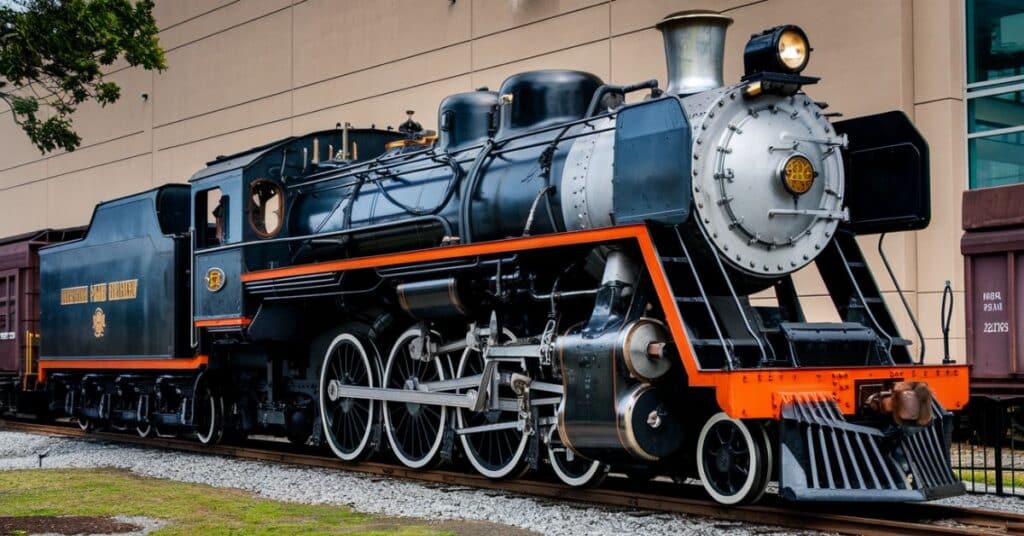 The Union Pacific Big Boy locomotive, measuring 100 feet, parked on the tracks.