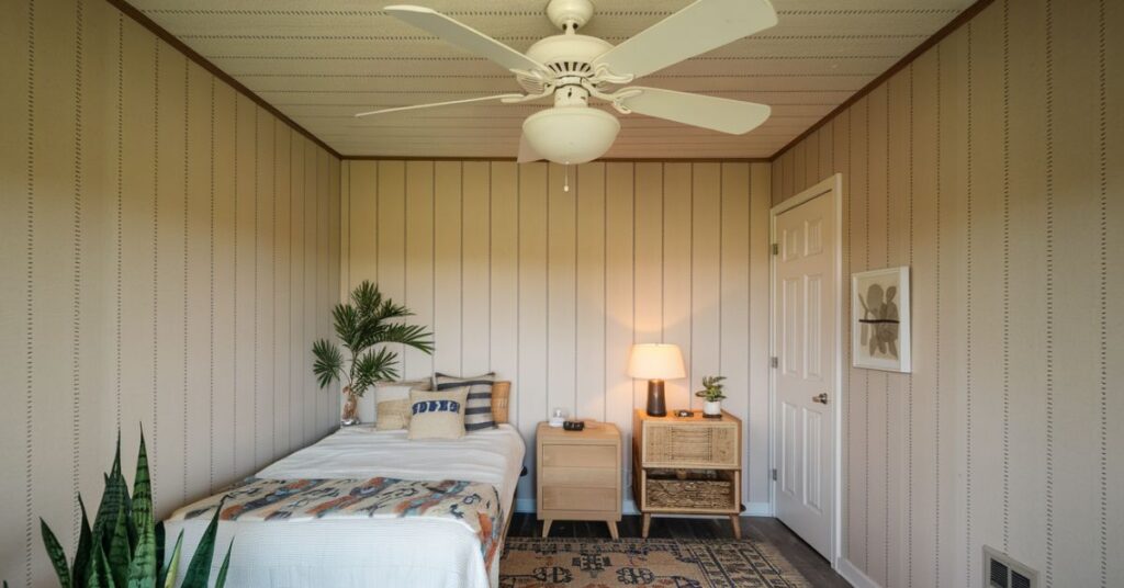 A ceiling fan in a cozy room, demonstrating its compact size.