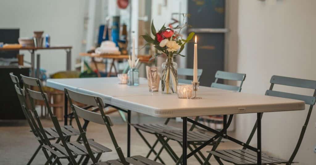 Three folding tables are set together for the small gathering.