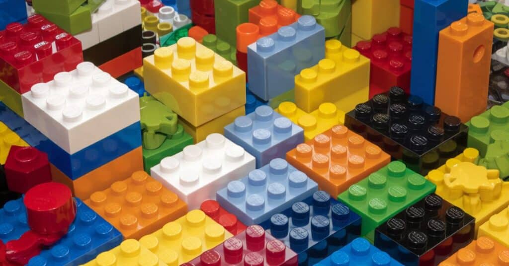 colorful standard 2x4 LEGO bricks, emphasizing the one inch height.