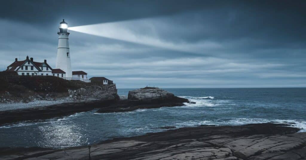 A 30 feet coastal lighthouse overlooking the sea.