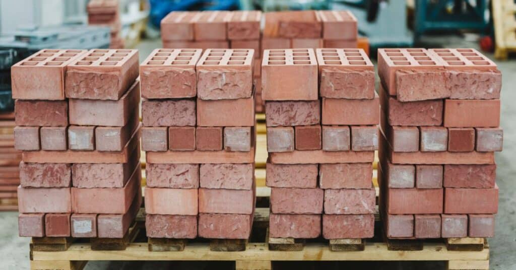 A photo of few US modular bricks, which are stacked on a wooden pallet.