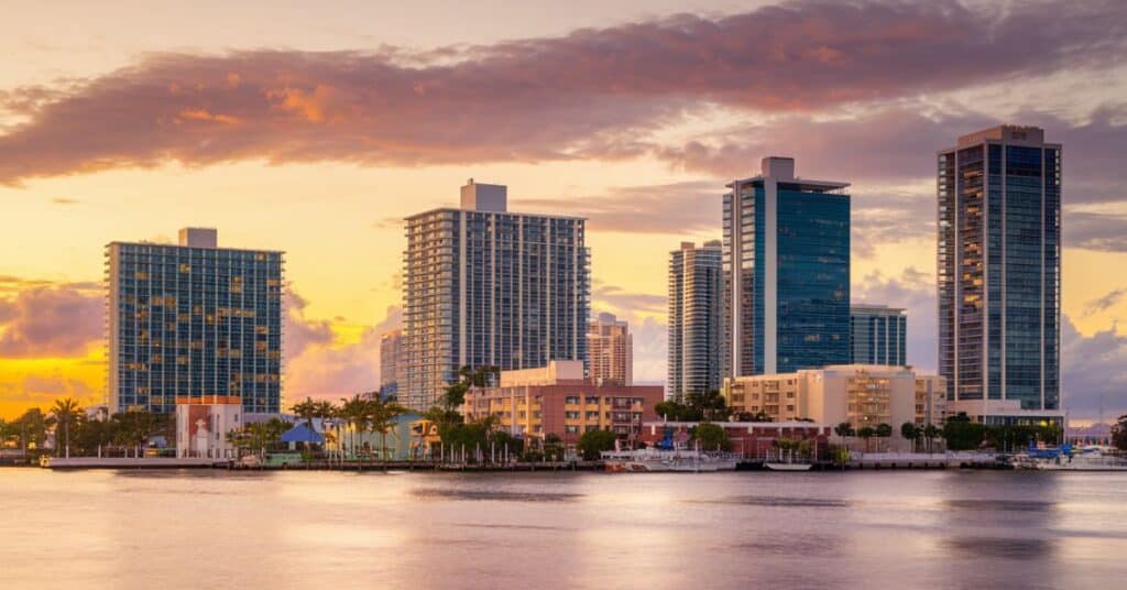 A photo of the South Florida skyline at sunset. There are multiple buildings with varying heights and designs.