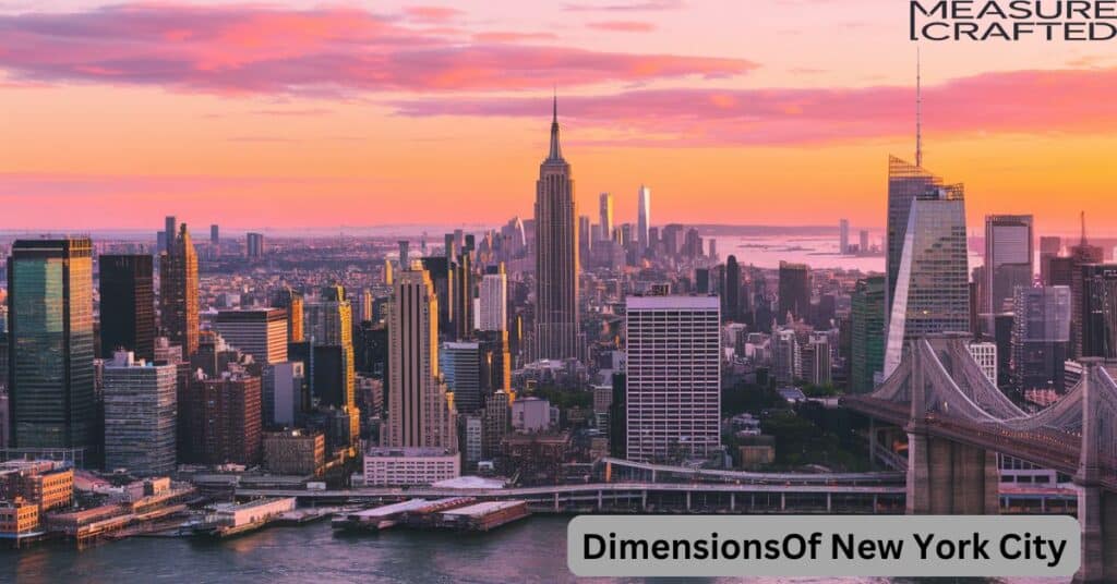 A drone's eye view of the New York City skyline at sunset. The Empire State Building is visible, as well as other skyscrapers. The East River is in the foreground, with a bridge connecting Manhattan to Brooklyn.