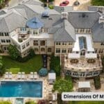 Ariel view of Mike Tyson house. It is a huge mansion with swimming pool. Two cars are also parked at the back side.