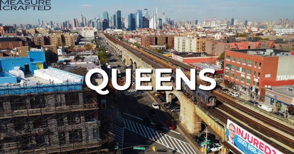 Ariel view of queens borough in New York City. The word "queens" is written over the picture.