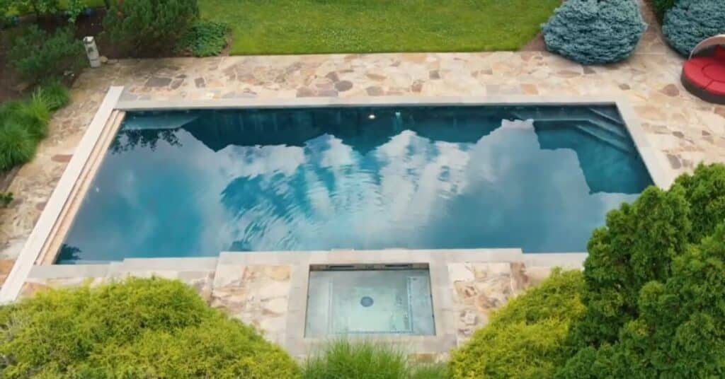 A picture of the swimming pool off Mike Tyson. this swimming pool is outside his mansion and is adding beauty to his italian styled mansion.